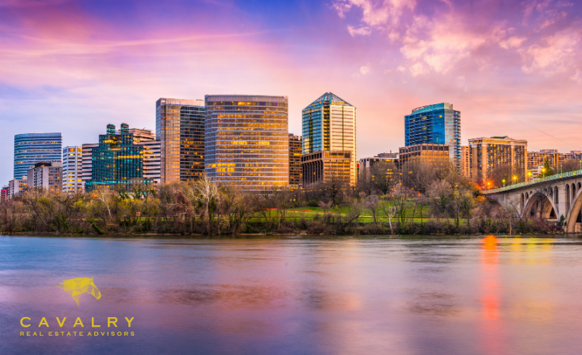 Rosslyn, Va., at Sunset with Cavalry Real Estate Advisors logo
