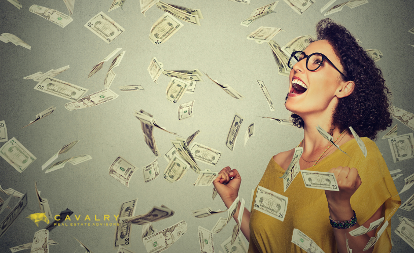Woman being showered with money to illustrate free money from tax credits